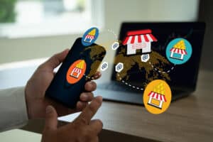 Person using smartphone to engage with local digital marketing icons, showcasing small business visibility and customer engagement strategies.